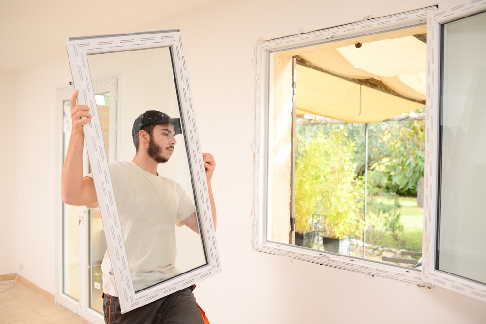 Handsome,Young,Professional,Man,Installing,And,Replacing,A,New,Home