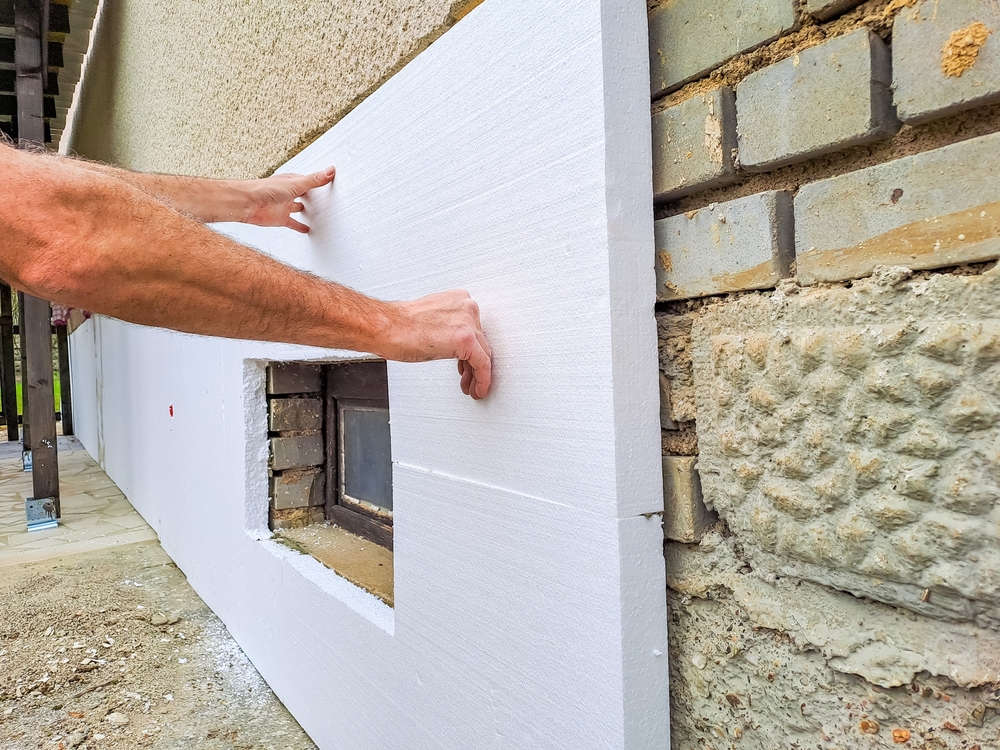 Installing,Rigid,Styrofoam,Insulation,Board,For,Energy,Saving,Of,The
